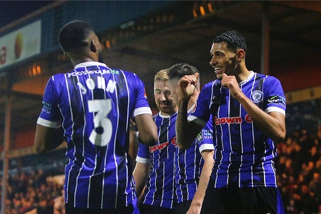 Rochdale AFC players celebrating win against Altrincham