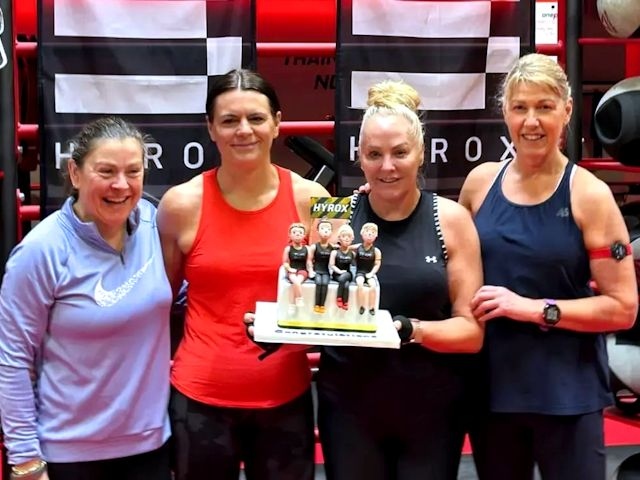 Joanne Wilson, 48, Alison Maughan, 49, Elaine Miller, 61, and Gill Lowe, 59, with a cake depicting their likenesses